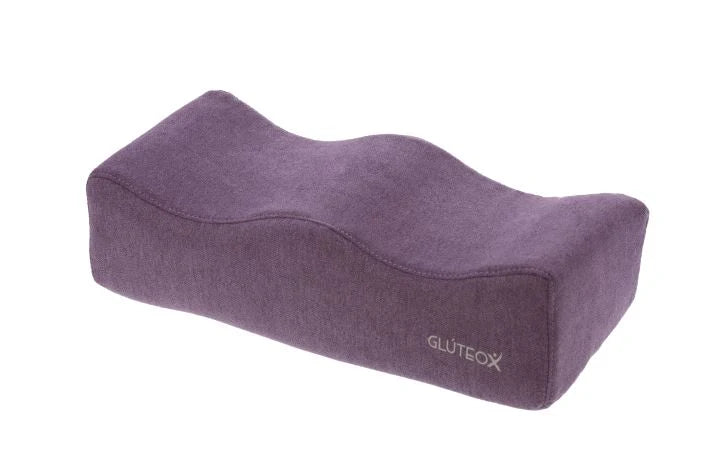 Cojín púrpura ergonómico.